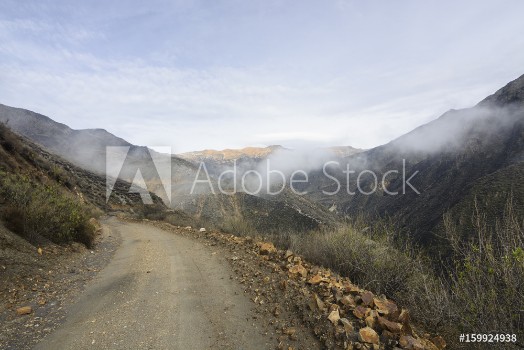 Bild på Road going up in the mountains Peruvian Andes South America